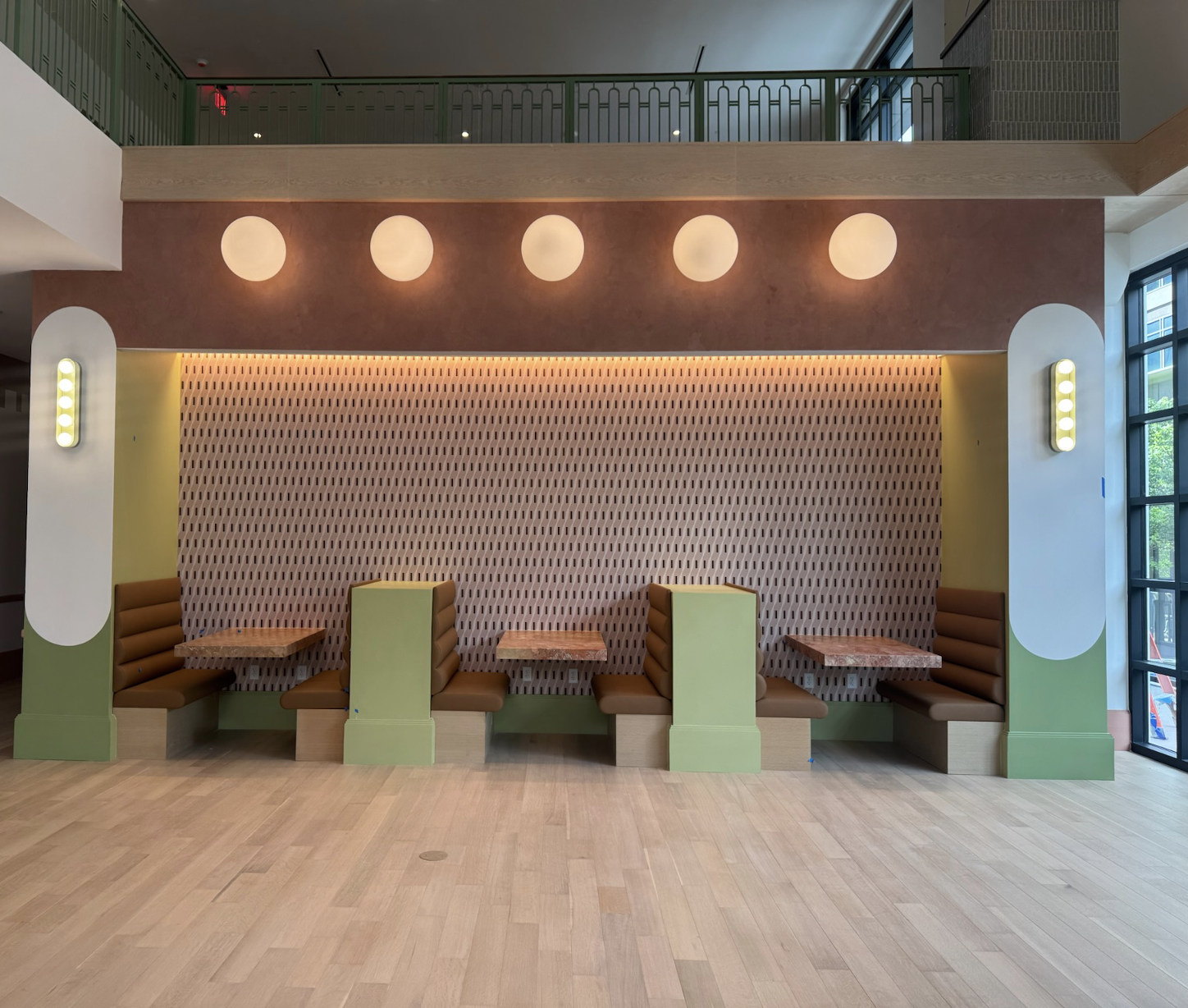 Booths inside lobby at Rambler Atlanta. 